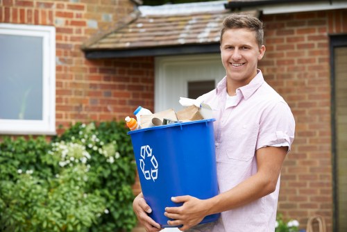 Workers managing builders waste during construction